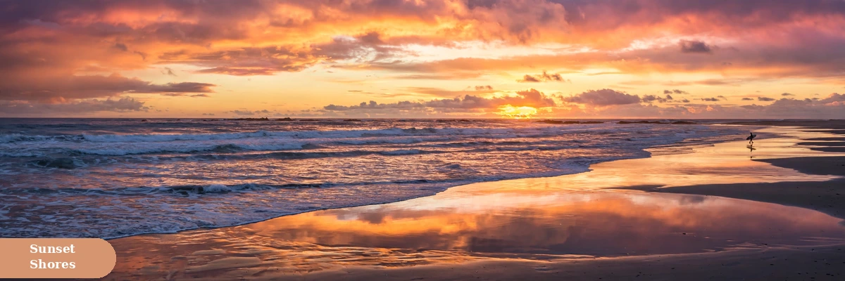 beach captions for instagram with golden sunset over ocean waves and a distant surfer silhouette