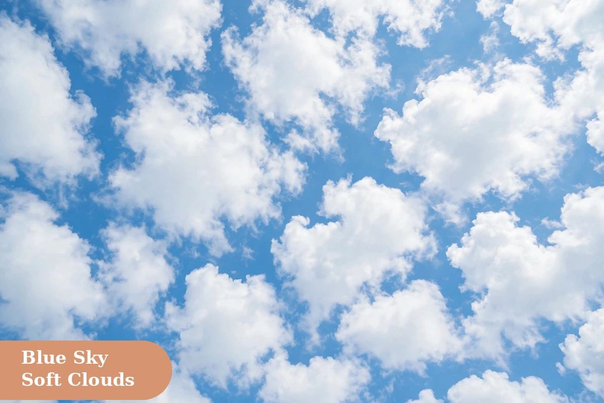 Sky captions for instagram with fluffy white clouds in a bright blue summer sky